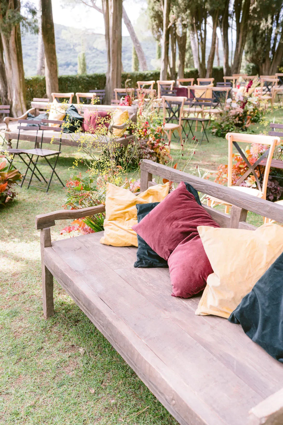 Bench with cushions for autumn wedding ceremony