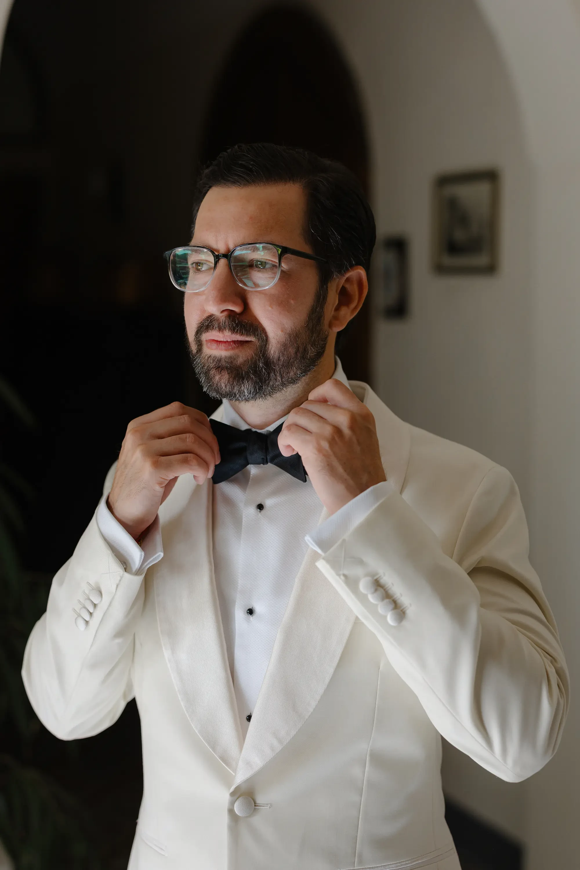 Groom getting ready portrait destination wedding
