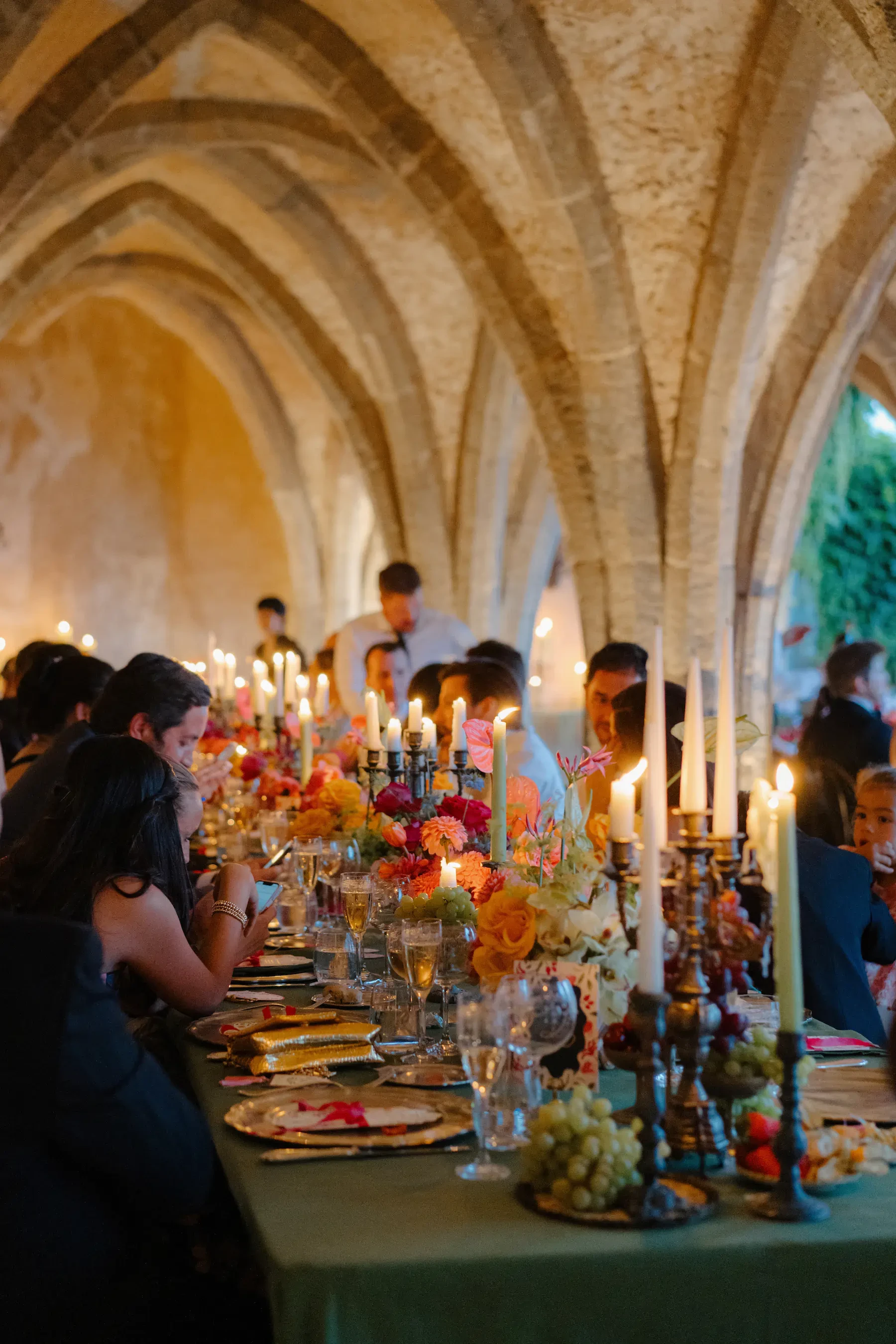 Candlelit Wedding Reception Dinner Under Stone Arches