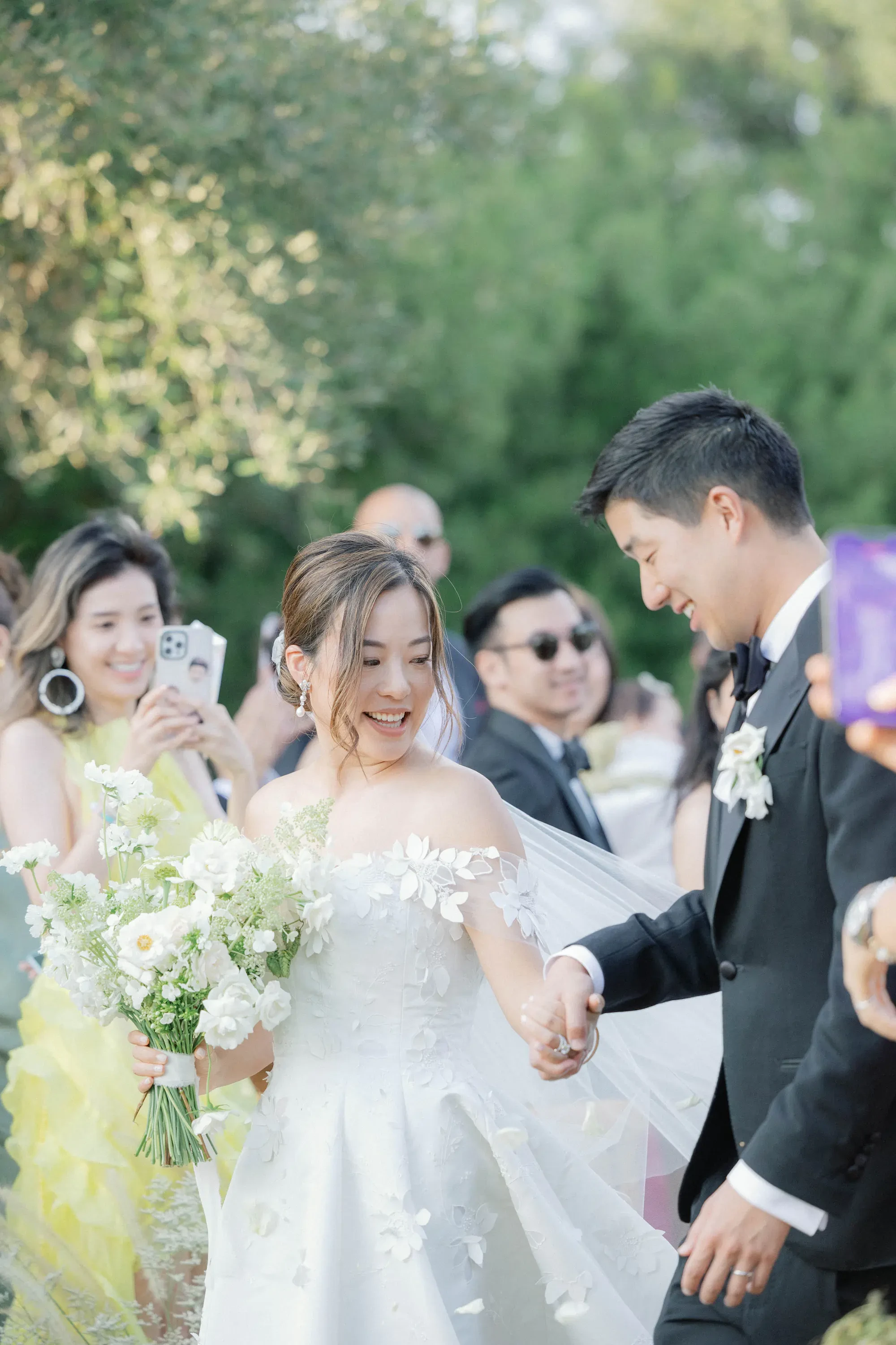 Happy Bride And Groom Holding Hands After Wedding Ceremony