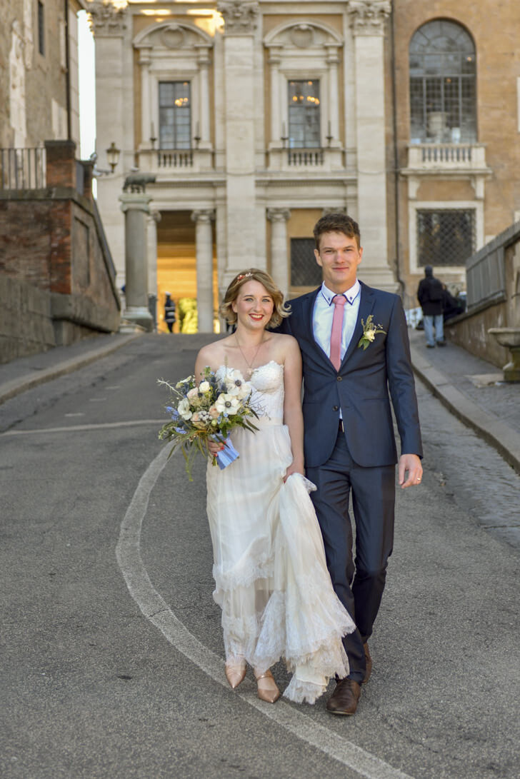Newlyweds in front of Campidoglio Palace