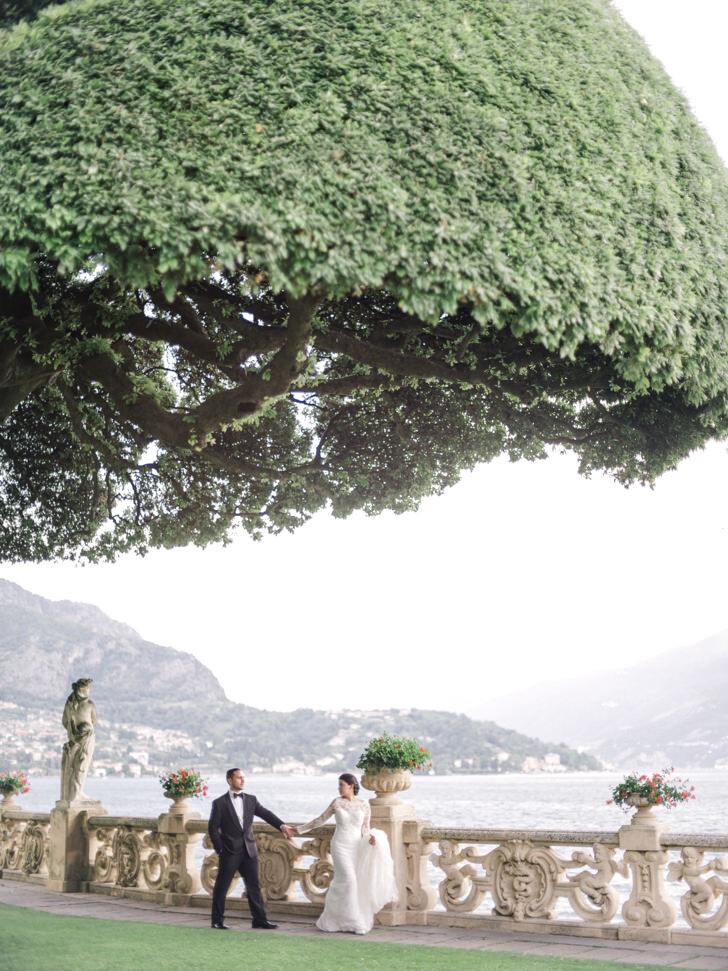 Bride and groom in the gardens of the villa