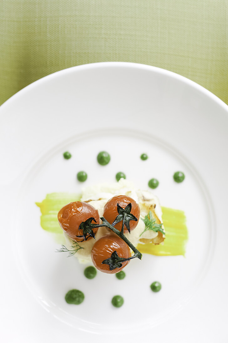 Morone “a la Meunière”, potato and yuzu purée and baked cherry tomatoes