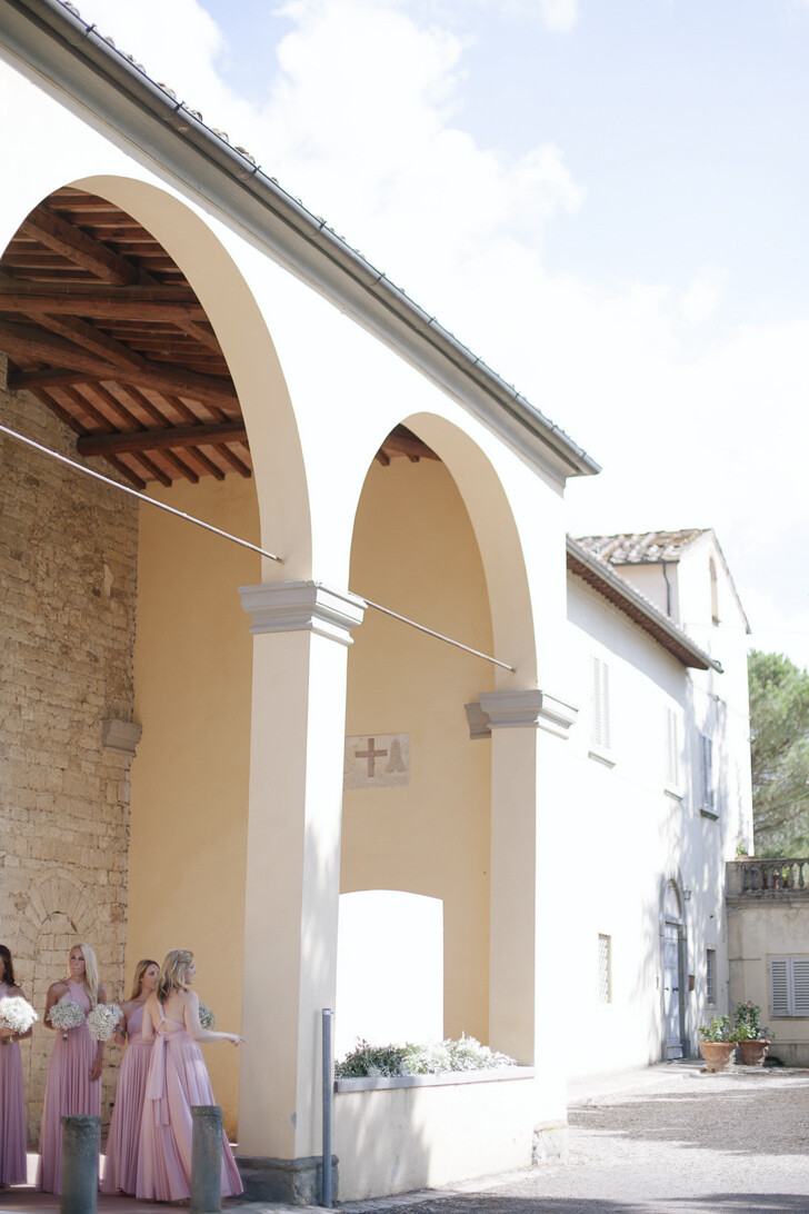 Bridesmaids waiting in front of the church
