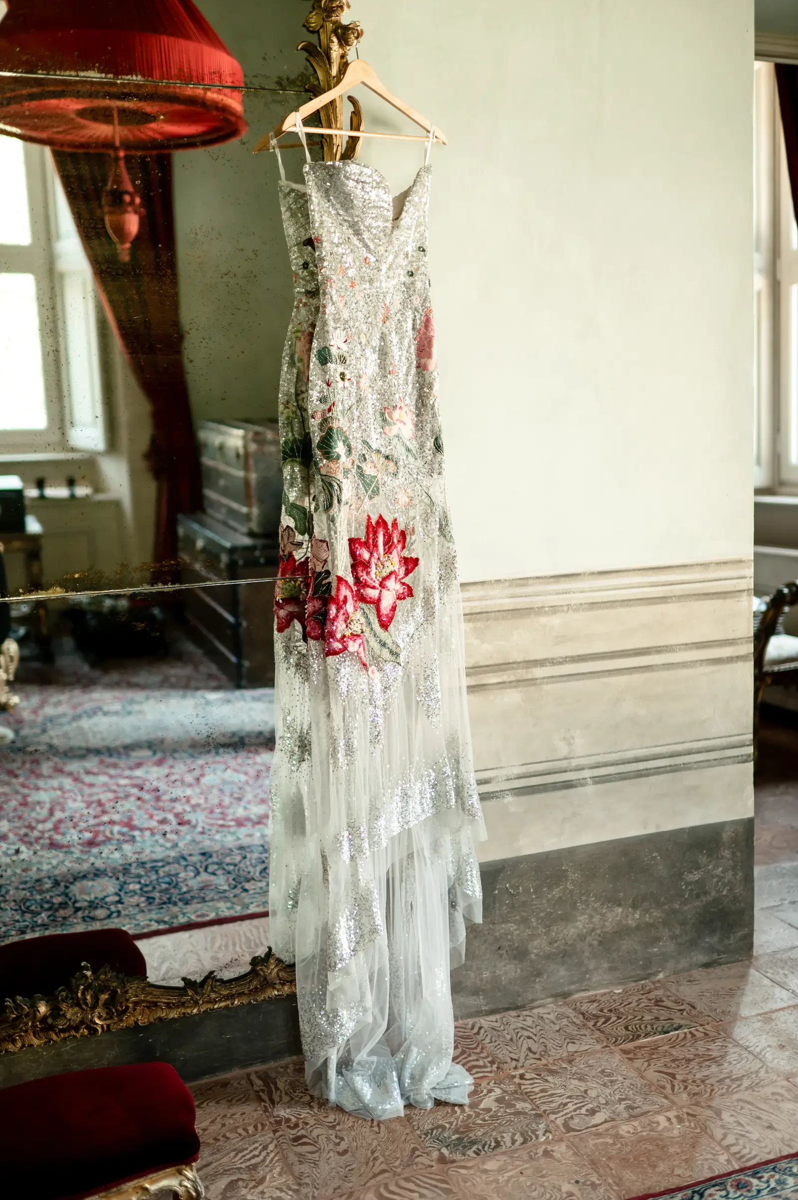 Sequined Floral Evening Gown Hanging On Antique Mirror