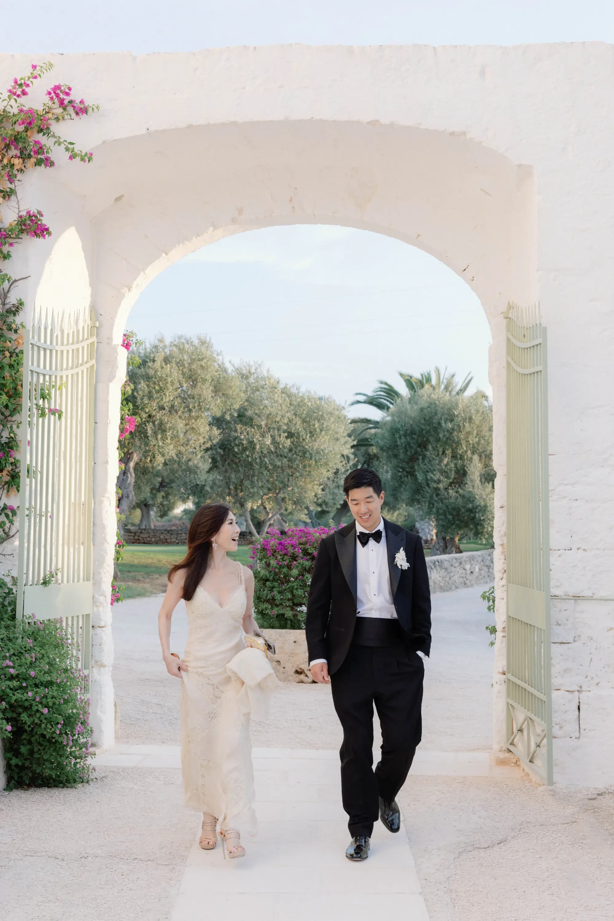 Puglia Masseria Wedding Groom Walking Through Archway