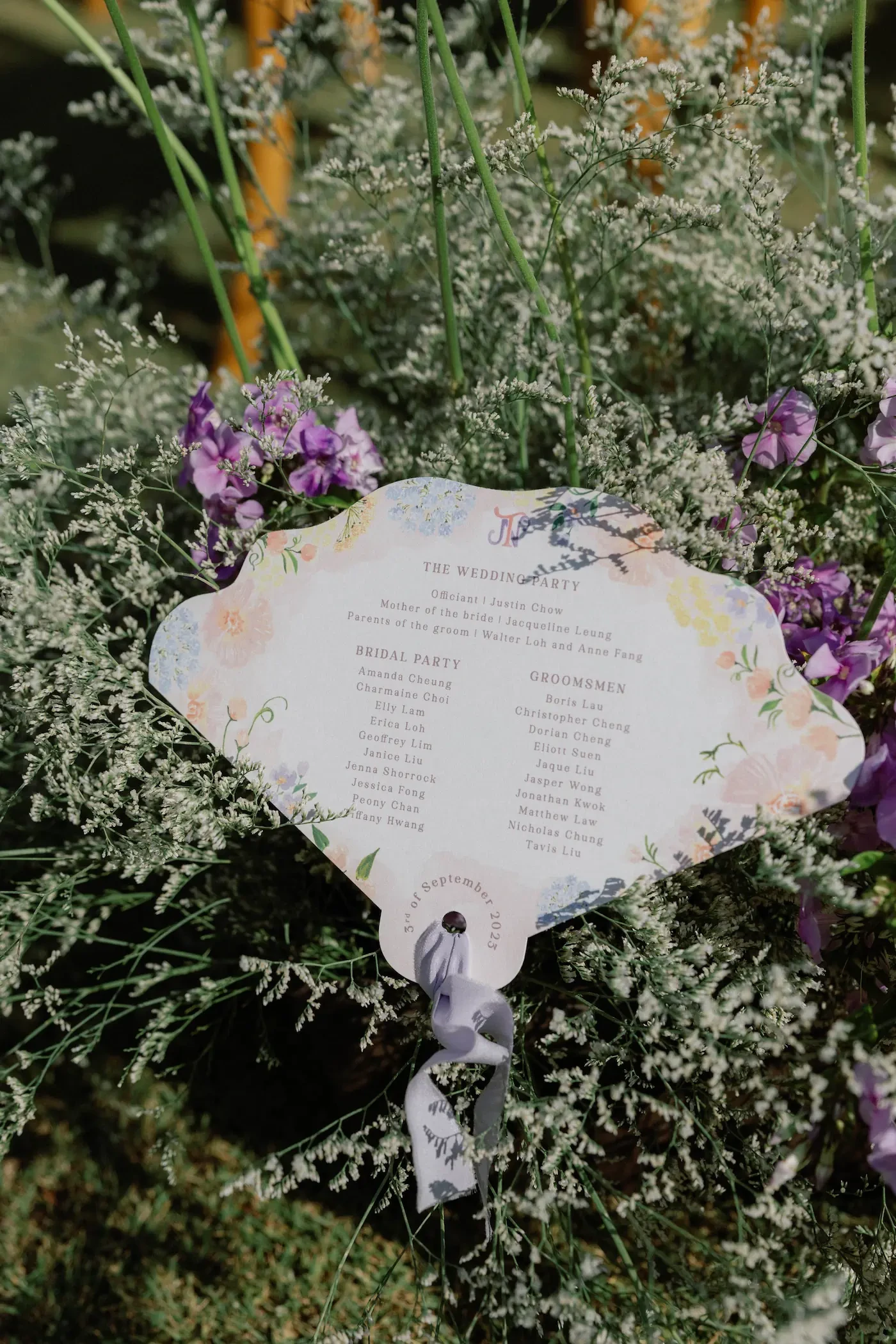 Fan Shaped Wedding Program In Floral Arrangement