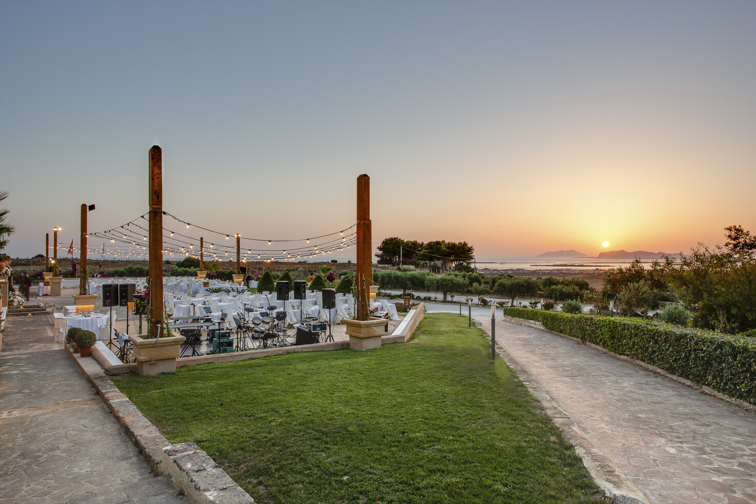 Outdoor wedding reception in the gardens of Baglio Oneto