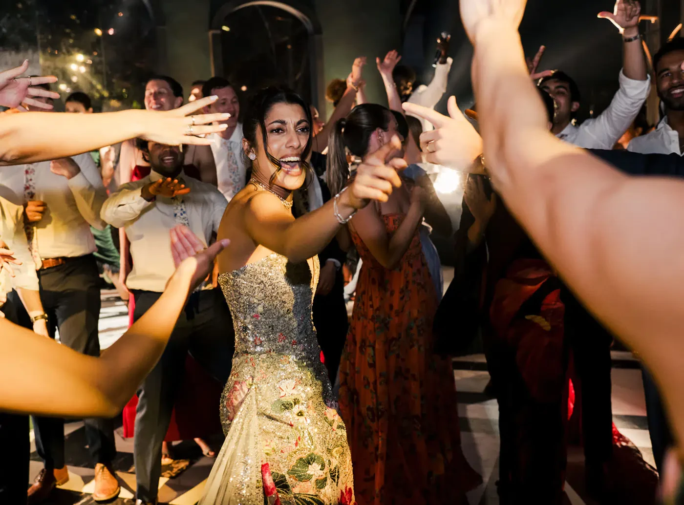 Bride Dancing In Crowd At Wedding Party