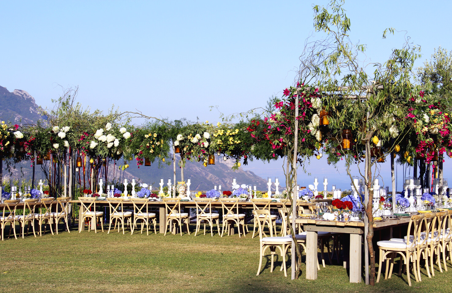 Flowers for welcome dinner on a terrace overlooking the sea in Ravello