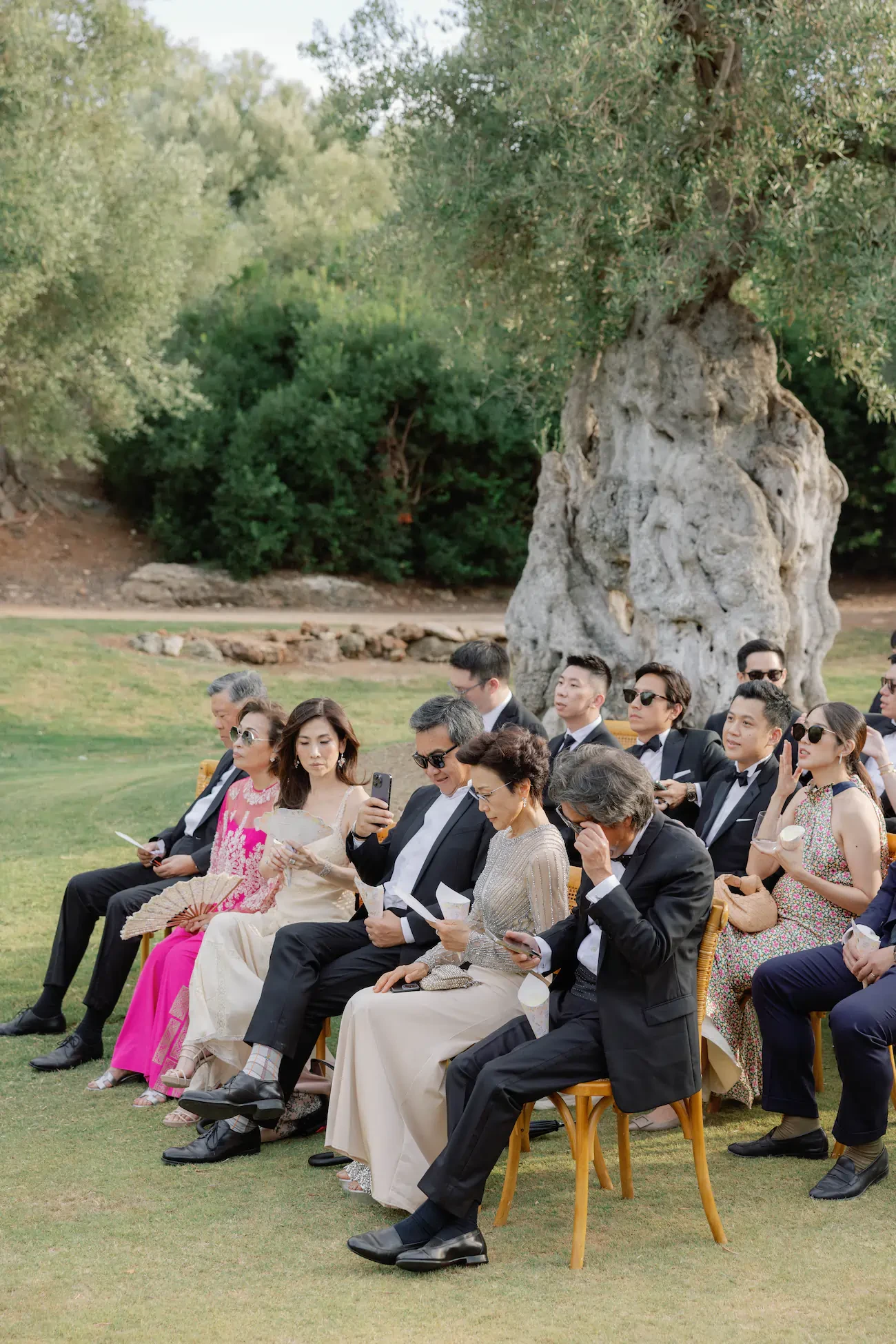 Wedding Guests Seated At Outdoor Ceremony