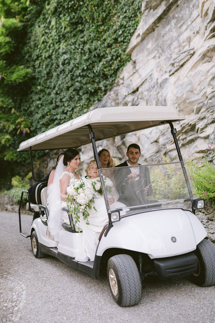 Arrival at the ceremony in a golf cart