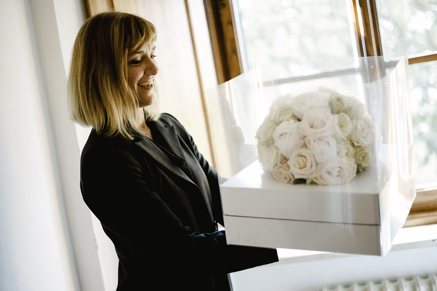 Wedding planner bringing the bridal bouquet