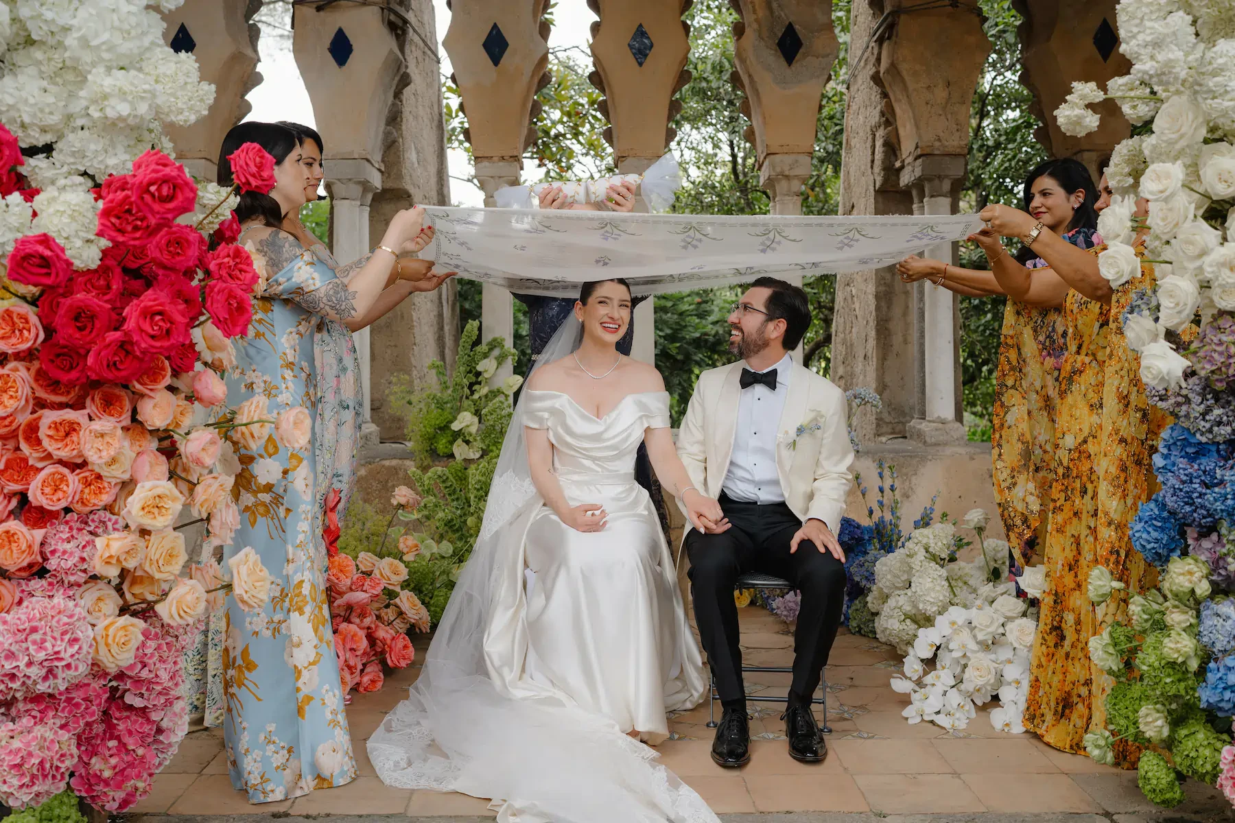 Luxury Wedding Ceremony with Colorful Floral Arrangements at Villa Cimbrone